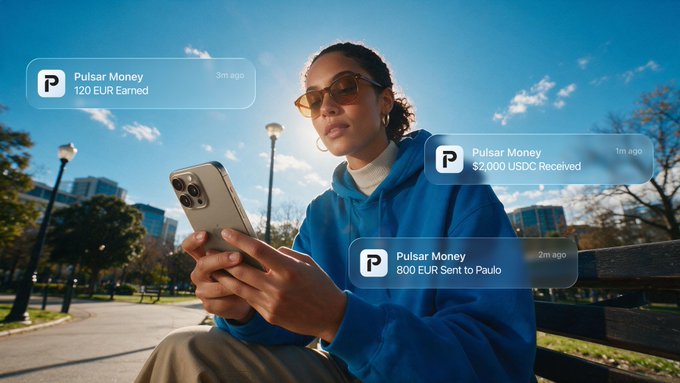 A young woman in a blue hoodie and sunglasses sitting outdoors holding a smartphone, with AR-style notification bubbles reading 'Pulsar Money 120 EUR Earned', 'Pulsar Money $2,000 USDC Received', and 'Pulsar Money 800 EUR Sent to Paulo'.