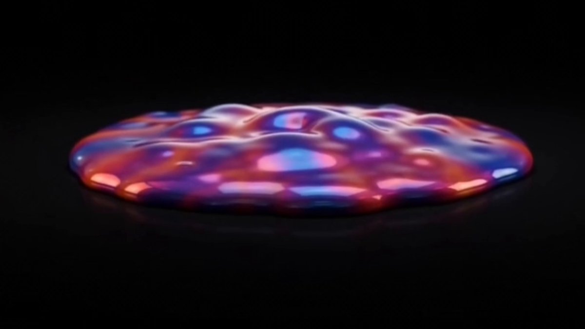 The image features a large, colorful blob of liquid with various shades of pink, blue, purple, and orange. The blob appears to be floating or suspended in space against a black background. The text "We are excited to have shared Nysa's vision and overall architecture" is written above the blob, indicating that this image was taken by someone named Nysa who has contributed to the project. The post also mentions that they are working on defining every detail of the protocol, which suggests that there might be more information or updates about the project in the future.