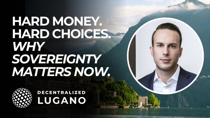 The image features a man wearing a suit and tie with his face prominently displayed against a backdrop featuring mountains, water, and trees. The text overlaying the image reads "Hard Money, Hard Choices. Why Sovereignty Matters Now." This suggests that the man is discussing the concept of hard money or the idea of making difficult choices in light of recent events involving governments and their control over financial systems.