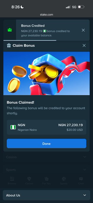 The image shows a mobile screenshot of stake.com displaying a "Bonus Claimed" confirmation with NGN 27,230.19 ($20.00 USD) credited to the user's account. The accompanying "see update" caption aligns with the screenshot, as it shows the latest bonus reward notification from the platform.