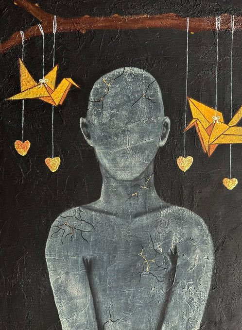 A dark, textured mixed-media artwork depicting a faceless, cracked gray humanoid figure surrounded by orange origami cranes and small hearts hanging from a branch.