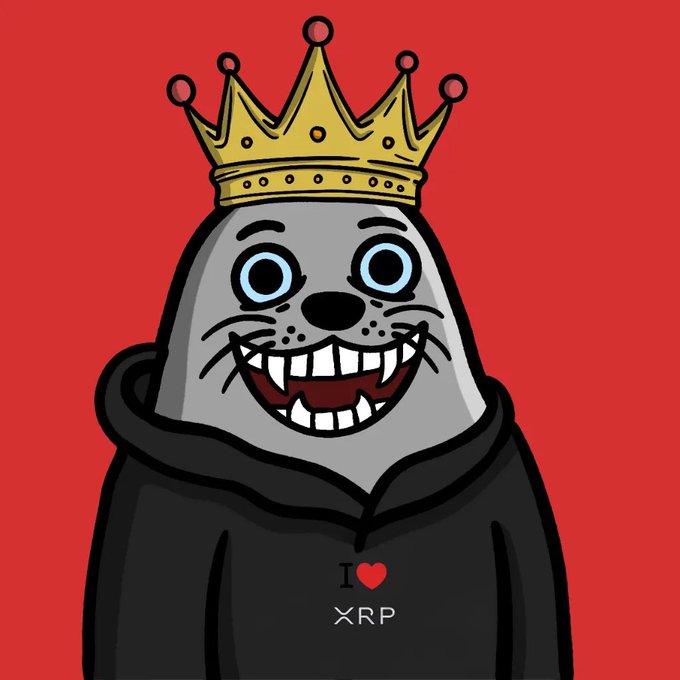 A cartoon seal wearing a gold crown smiles widely with prominent teeth against a bright red background, dressed in a black hoodie displaying the text 'I ❤ XRP'.