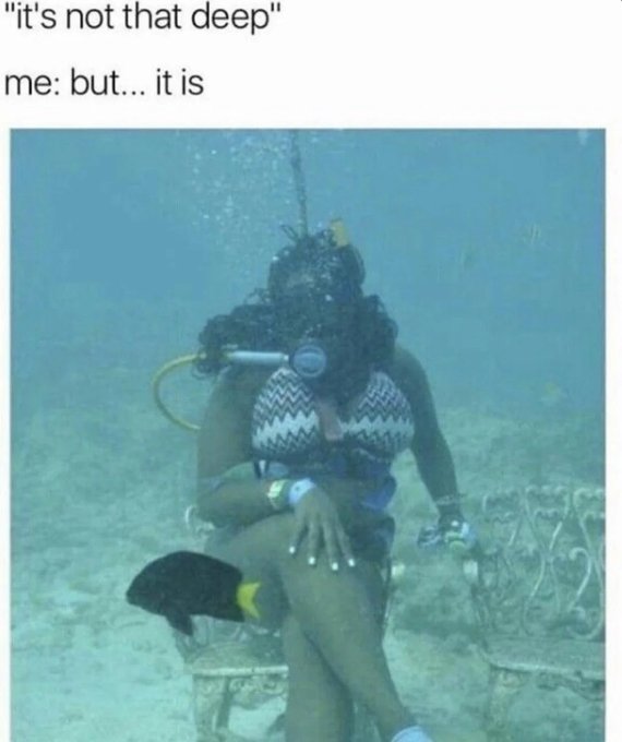 A scuba diver sits underwater on a decorative chair while fully suited up in diving gear, beneath text reading "it's not that deep" / "me: but... it is".