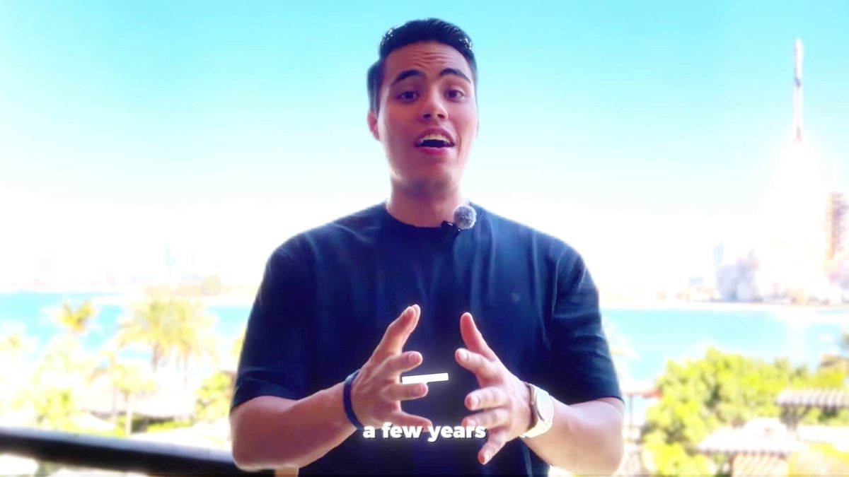 The image features a man standing outside with his hands together, possibly giving a speech or presentation. The background shows a city skyline, indicating that he might be at an event or gathering in an urban setting. The caption of the image reads "A few years" and is related to the content of the post about Solana coins on social media platforms.