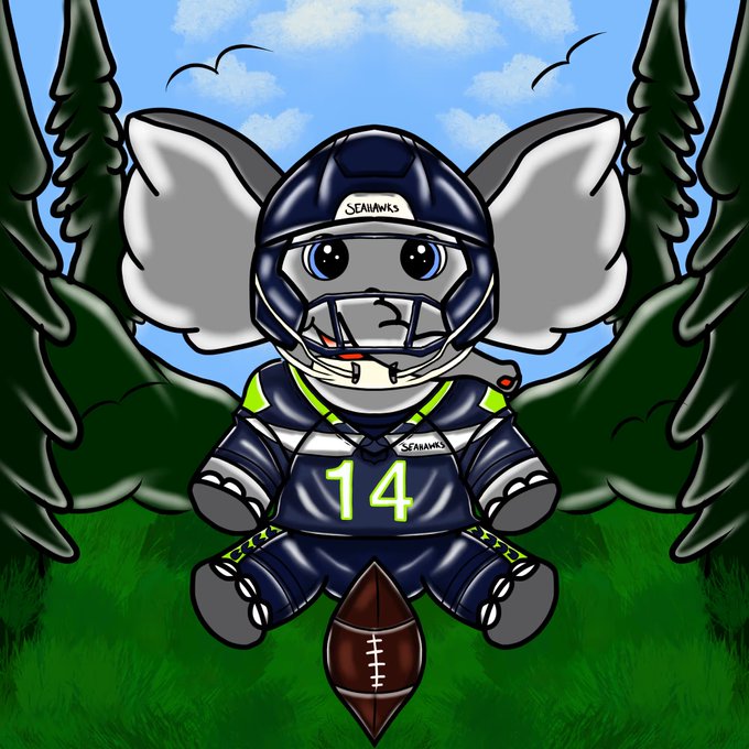 A cartoon elephant mascot wearing a Seattle Seahawks uniform (jersey #14) and helmet, sitting in grass with a football between its feet and pine trees in the background.