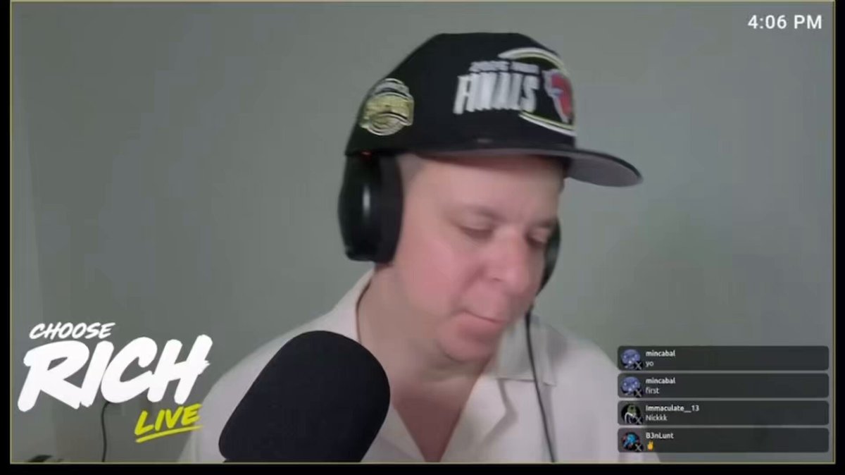 The image shows a man wearing headphones and a hat with the words "Choose Rich" written on it, who appears to be talking into a microphone or recording device. The background of the image is white, which contrasts with the black text on the screen. The caption below the image reads, "Big news coming out right now: MicroStrategy. Just absolute disaster." This suggests that there might have been some significant news related to MicroStrategy in the past few days or hours, and it has caused a negative impact on the market.