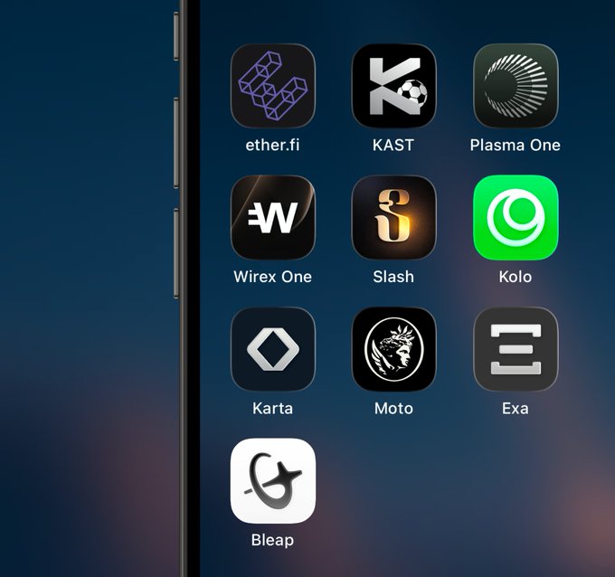 A smartphone screen displays a folder of cryptocurrency app icons including ether.fi, KAST, Plasma One, Wirex One, Slash, Kolo, Karta, Moto, Exa, and Bleap.