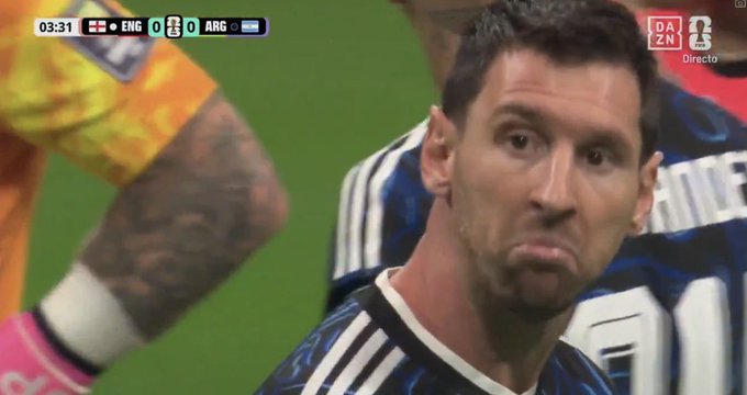 Screenshot of Lionel Messi with a pursed-lip expression during an Argentina vs. England soccer match, with the scoreboard showing 0-0 at 03:31.