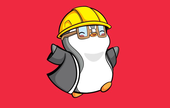 A cartoon penguin mascot wearing a yellow construction hard hat and glasses, standing with wings on its hips against a bright red background.