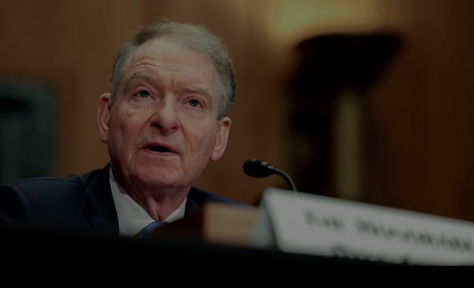 A man in a dark suit speaking at a congressional hearing, identified by a partially visible nameplate as 'ROD ROSENSTEIN'.