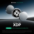 The image is a promotional banner for XDP cryptocurrency, featuring a sleek silver coin-like emblem with geometric details, along with the "XDP" ticker prominently displayed and the KuCoin logo at the top, aligning with the post announcing XDP's listing on the KuCoin exchange.