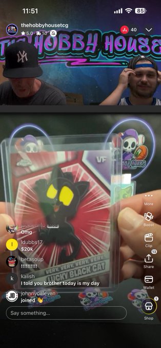 A TikTok livestream from "thehobbyhouseetcg" at 11:51 shows two men reacting excitedly behind a colorful "Hobby House" sign, while a hand holds up a holographic "Very, Very, Very, Very Lucky Black Cat" card with 40 viewers watching. The post celebrating the final pack and a Monster hit (@veefriends MAGIC) aligns with the displayed card reveal and lively chat reactions visible on screen.