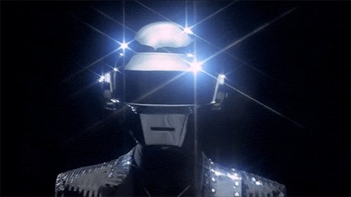 urn of gold and silver, with a white face mask and helmet, illuminated by blue and white lights against a black background.