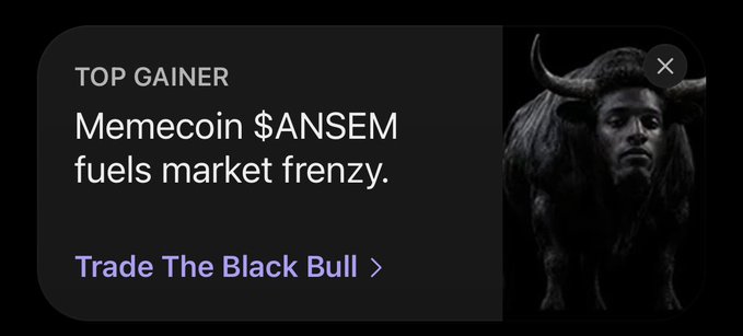 A 'TOP GAINER' promotional notification stating 'Memecoin $ANSEM fuels market frenzy' with a 'Trade The Black Bull' link and image of a figure with a bull.