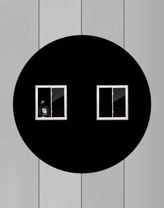 A black circular void against a gray background contains two small windows, one of which shows a figure wearing a cap with a skull logo—evoking the surreal, minimal "GM" meme aesthetic paired with the cheerful "#TEZOSTUESDAY" greeting.