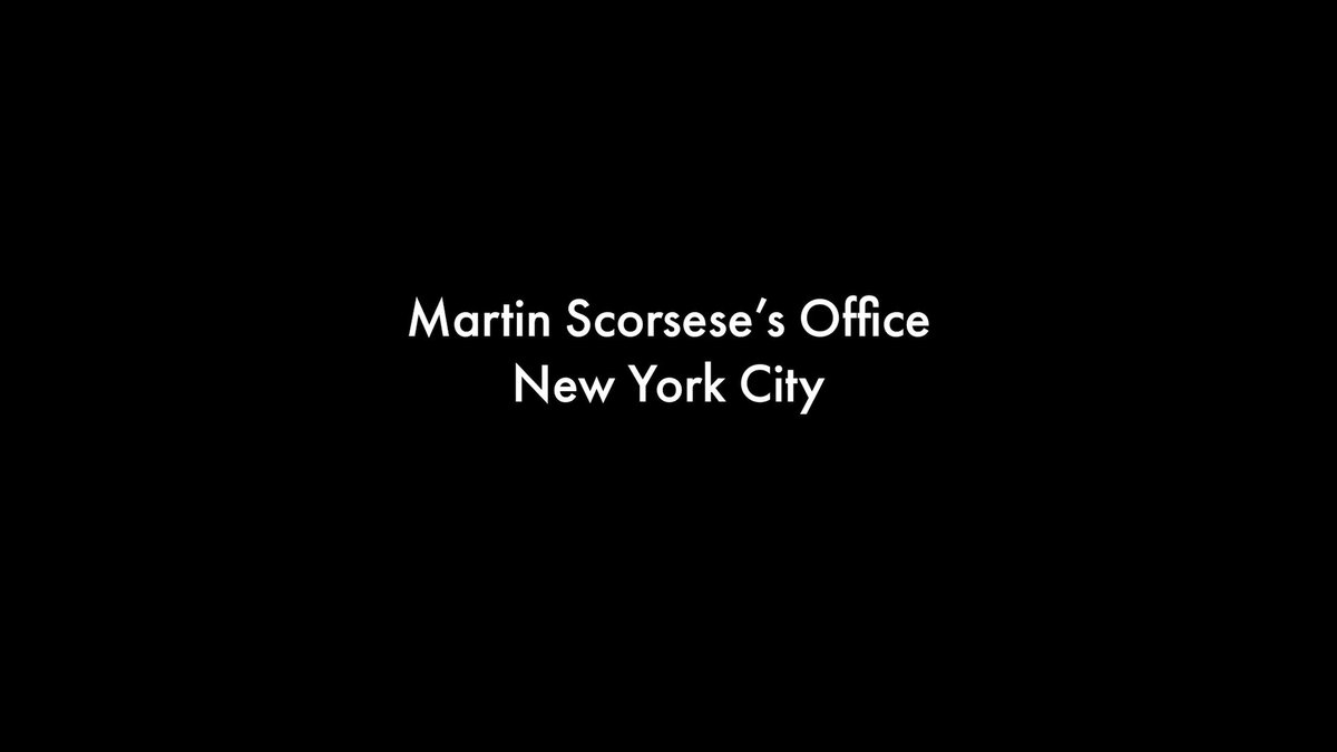 The image features a black and white photo with the text "Martin Scorsese's Office New York City" written in white at the bottom of the frame. The background appears to be a gray color, which contrasts nicely with the white text. This design choice makes the text stand out prominently against the backdrop.