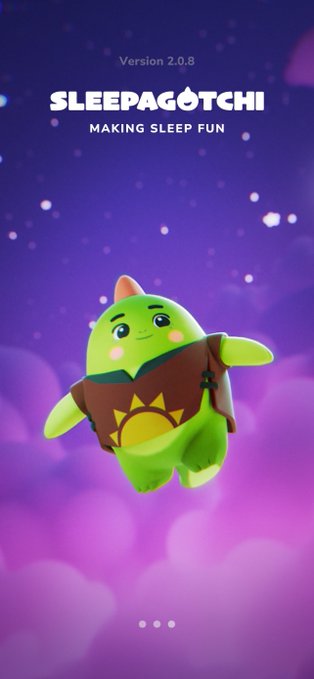 The image features a cartoon green monster or frog that appears to be floating in space with clouds around it. The creature has a brown shirt, giving it a unique appearance. The background of the image is purple, which contrasts with the green color of the monster. There are also some stars visible in the sky above the creature.