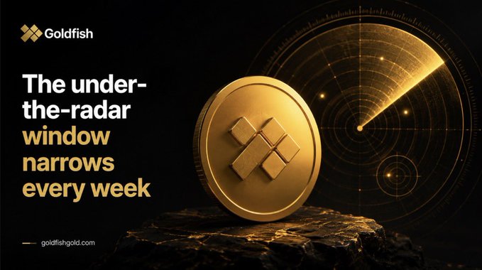 A promotional graphic for Goldfish cryptocurrency featuring a gold coin with their logo on a rock, with text reading 'The under-the-radar window narrows every week' and 'goldfishgold.com'.