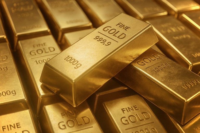 The image features a large pile of 100 gold bars placed closely together. Some of these bars are touching, indicating that they might be in a close arrangement or could be stacked atop one another with minimal space between them. The background is gray, providing a neutral backdrop that allows the gold bars to stand out prominently. Below this text block, which seems to be the main focus of the post, you can see the hashtag #GOLD and a dollar sign indicating that the content may be related to an online purchase or sale involving these gold bars. The image's caption captures the essence of what is being posted, and it effectively communicates the details about the gold bars' condition, quantity, and value.
