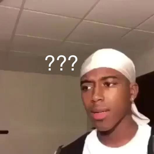 Low-quality selfie of a young man wearing a white durag with a confused expression and three question marks overlaid on the image.