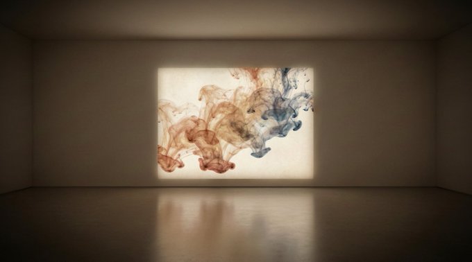 An empty, minimalist room with reflective floors features a projected artwork on the wall showing swirling red and blue ink dispersing in water.