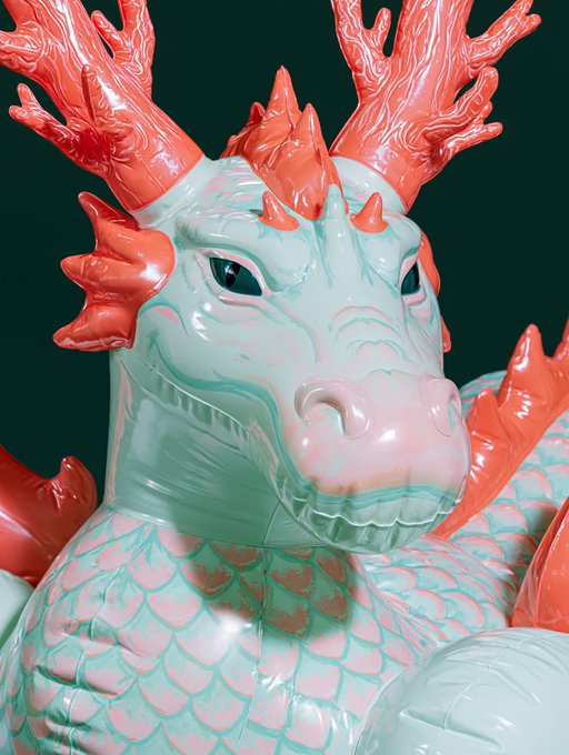 A close-up 3D render of a stylized dragon figurine with a glossy mint-green body, pinkish coral scales, and coral-orange antlers and spikes.