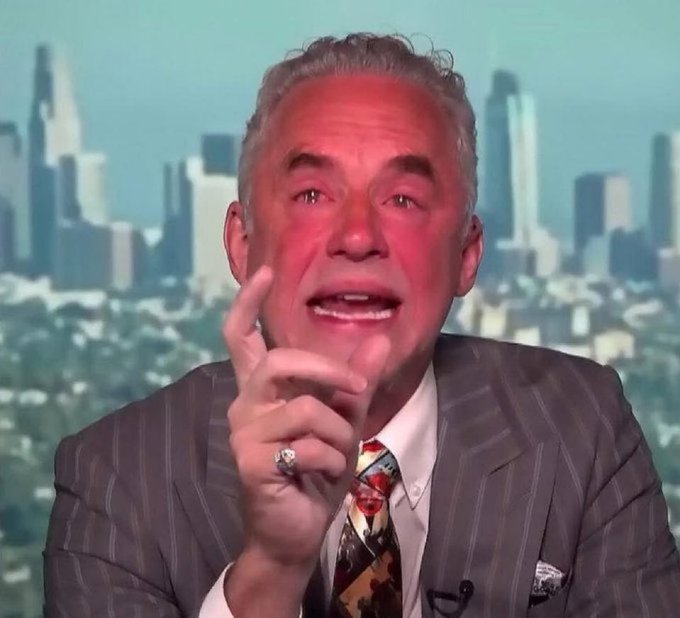 A distinguished older man in a pinstripe suit and patterned tie, wearing a championship-style ring, gestures animatedly with his finger raised while speaking in what appears to be a television studio with a city skyline backdrop.

The image humorously captures the enthusiastic, emphatic "preaching" expression often used in memes to represent someone passionately trying to explain or convince others about a topic—in this case, Bitcoin to skeptical friends and family.