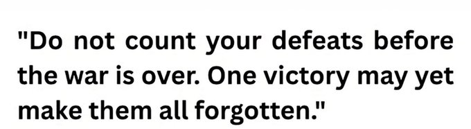 A motivational quote in black text on a white background: 'Do not count your defeats before the war is over. One victory may yet make them all forgotten.'