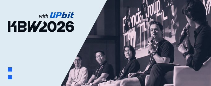 The image is a promotional banner for KBW2026 with Upbit, showing a panel of speakers at what appears to be a blockchain/web3 industry event (with "Formula Group" partially visible on the stage backdrop), featuring several seated panelists including one holding a microphone. The image ties to the post by promoting the upcoming Korea Blockchain Week 2026 event, where free tickets are being distributed through a Google Form giveaway.