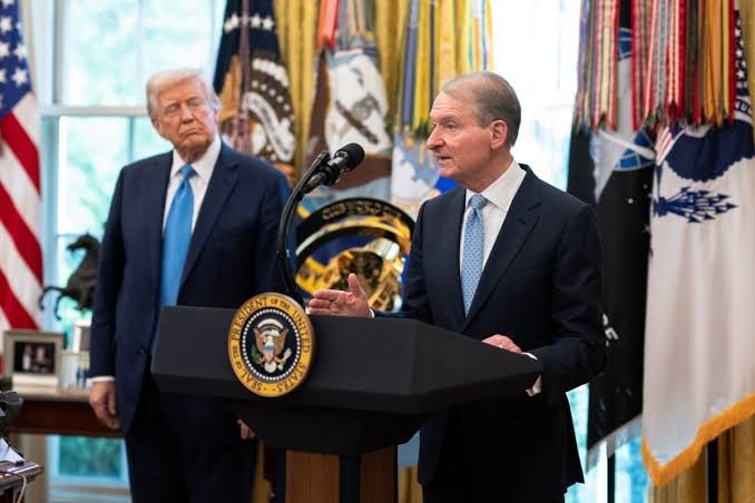 President Donald Trump stands alongside Senator Tim Scott at the White House, as Scott speaks at a podium bearing the Presidential Seal, addressing the SEC's recent decision to grant temporary relief for limited onchain trading of tokenized equities—a regulatory shift that opens the door to expanded digital asset innovation in U.S. capital markets.