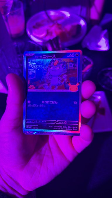 A person holds up a holographic Pokémon trading card featuring a Japanese Blastoise card (60 HP) illuminated by vibrant pink and purple lighting, showcasing its shiny, reflective surface. The caption fits the post perfectly, as the user is showing off their rare holographic "Furious Tusk" (actually Blastoise) card to see if their friend thinks it makes them rich.