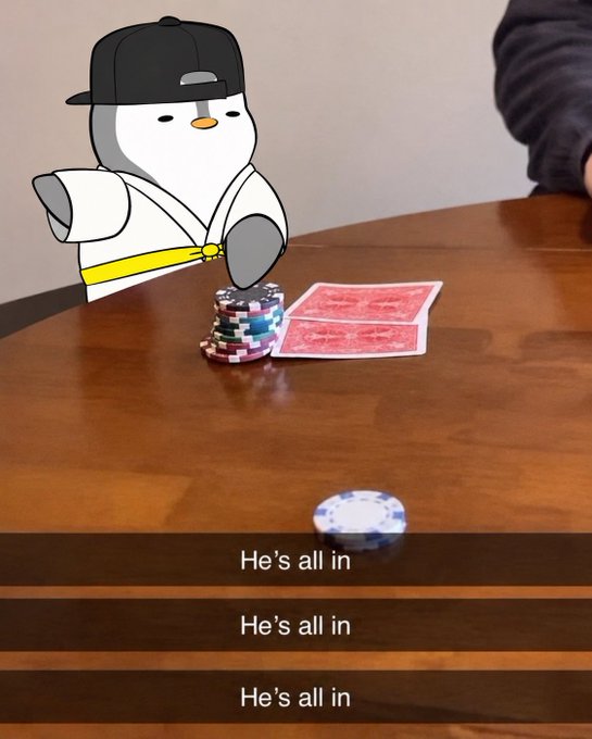 An animated penguin sticker wearing a black cap and white robe pushes a stack of poker chips forward on a wooden table, accompanied by the text 'He's all in' repeated three times.