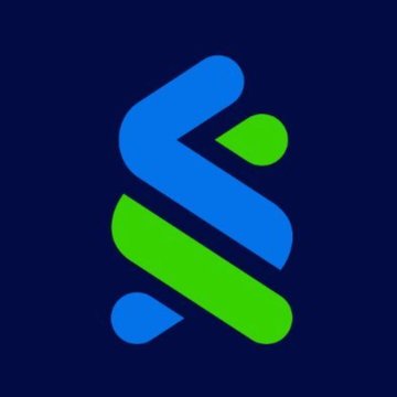 The image displays a stylized "S" logo in blue and green against a dark navy background, representing Standard Chartered Bank's branding. This visual ties to the post about Standard Chartered launching its crypto trading service for UAE clients, reflecting the bank's new venture into digital assets.