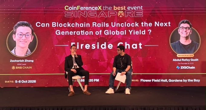 A fireside chat panel at the CoinFerenceX Singapore event featuring Zachariah Zhang (APAC Lead, BNB Chain) and moderator Abdul Rafay Gadit (Co-Founder & COO, ZIGChain), discussing "Can Blockchain Rails Unlock the Next Generation of Global Yield?" at Flower Field Hall, Gardens by the Bay, on 5-6 Oct 2026.