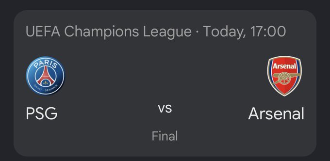 The image shows a poster with two logos - one representing the Champions League and another representing the Arsenal football team. The text below the images indicates that the Champions League final will be taking place at 17:00, while the Arsenal match is scheduled for 17:30. This suggests that the image was taken during the day when these events are happening.