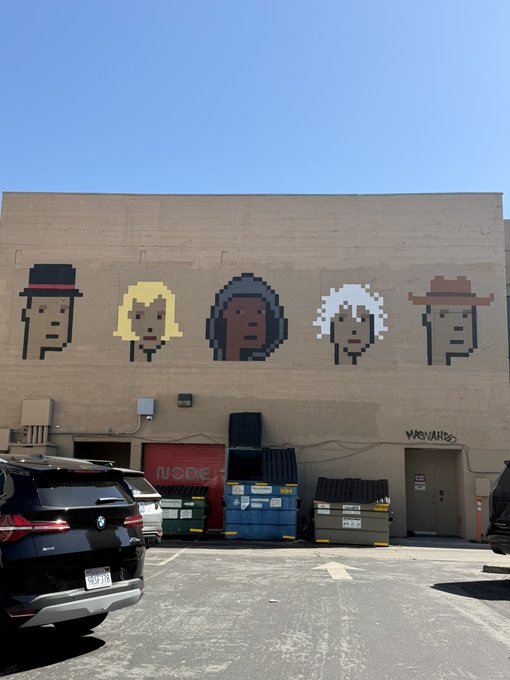"Gm" stands for graffiti, which can be seen on a building's exterior wall in the image.
