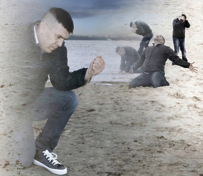 A surreal, digitally composited image showing a man with an undercut hairstyle in a crouched position seemingly emerging from or merging with sand, while in the background other figures pose dramatically on a beach near water.