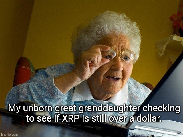 Meme image of an elderly woman with white hair and glasses peering intently at a laptop screen, with caption text reading 'My unborn great granddaughter checking to see if XRP is still over a dollar.'