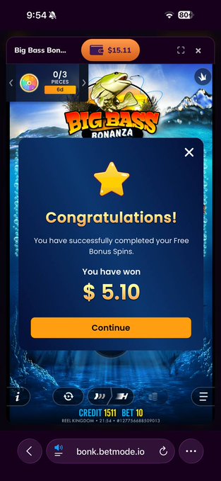 A mobile screenshot showing a 'Big Bass Bonanza' slot game with $15.11 balance and a 'Congratulations!' pop-up stating 'You have successfully completed your Free Bonus Spins. You have won $5.10'.