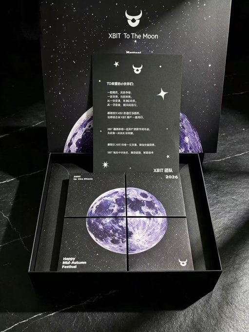 A promotional display features a black box with 'XBIT To The Moon' and 'Happy Mid-Autumn Festival' text, containing an image of Earth divided into four puzzle-like segments.