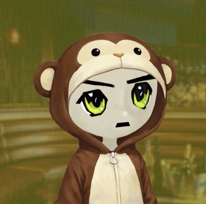 An anime-style character wearing a brown monkey hooded costume with large green eyes, set against a blurred stone background.
