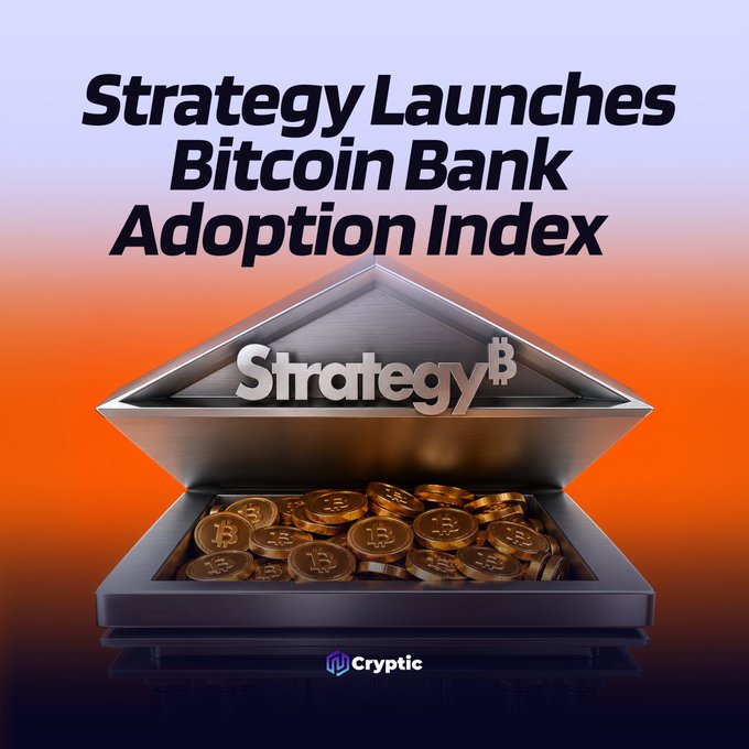 A stylized graphic shows a metallic vault filled with gold Bitcoin coins, displaying the text "Strategy Launches Bitcoin Bank Adoption Index" alongside the Strategy₿ logo and a Cryptic watermark, visually emphasizing the company's new metric for tracking digital asset adoption by major banks.