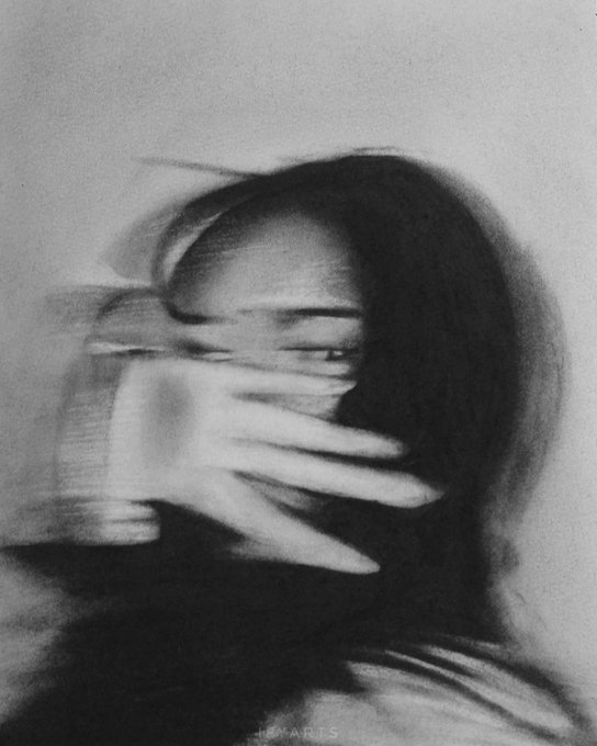A grainy black-and-white artistic portrait of a person with long hair covering their face with their hand, creating a motion blur effect, with a faint 'D.P. ARTS' watermark at the bottom.