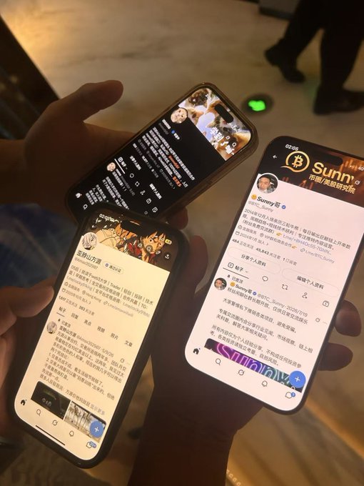Multiple hands hold smartphones displaying social media feeds in Chinese, with one screen showing an account named 'Sunny' featuring Bitcoin branding.