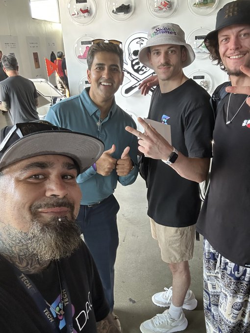 Four men pose together at the Solana Summer House Takeover, with one wearing a "Solana Summer" bucket hat and another showing off a peace sign, while a "YEET" logo is visible on the wall behind them.