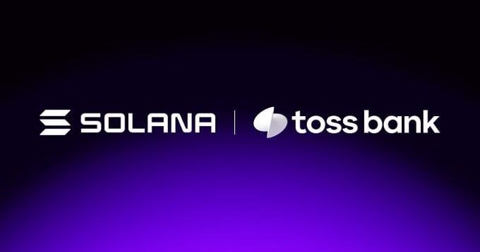 The image features a logo that says "solana" and "toss bank" written in white letters against a purple background. The text below the logo reads, "Just In: @tossOfficial has partnered with @solana to explore blockchain-based remittances". This suggests that the post is about a partnership between two companies - solana and toss bank - to explore innovative ways of using blockchain technology for financial transactions.