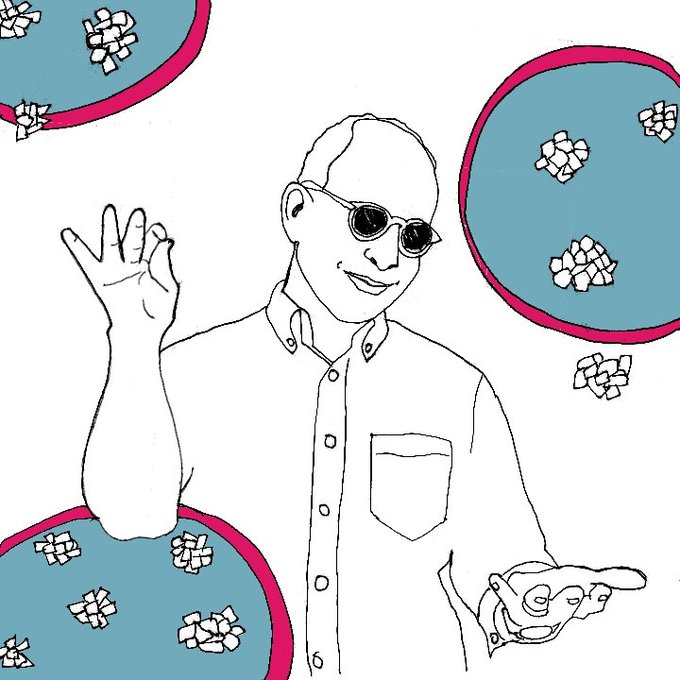 A line drawing of a smiling bald man wearing sunglasses and a button-up shirt, surrounded by stylized petri dishes containing crystalline shapes.