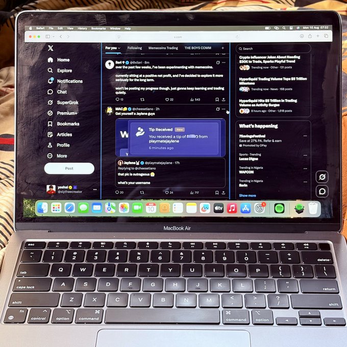 A MacBook Air displays X (formerly Twitter) with posts about memecoin trading, including a tip of 0.3883 from "playmatejaylene" and discussions about Hitox trading, aligning with the post's mention of using a new web3 tool to "cook" in the crypto/memecoin space.