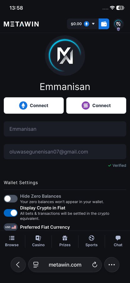 The image shows a Metawin account profile for "Emmanisan" (oluwasogunenisan07@gmail.com), which is Verified and has wallet settings including a $0.00 balance displayed at the top. The screenshot captures the user's crypto gaming account, providing visual proof to accompany the claim of winning $150, with the caption suggesting reinvesting winnings to potentially grow into millions.