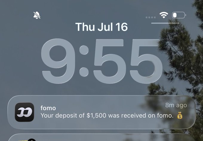 The image shows a phone lock screen displaying a notification from the fintech app "fomo" at 9:55 AM on Thursday, July 16, confirming that a $1,500 deposit was received 8 minutes ago, fitting the post's theme of receiving money—this time likely a bug bounty payout.